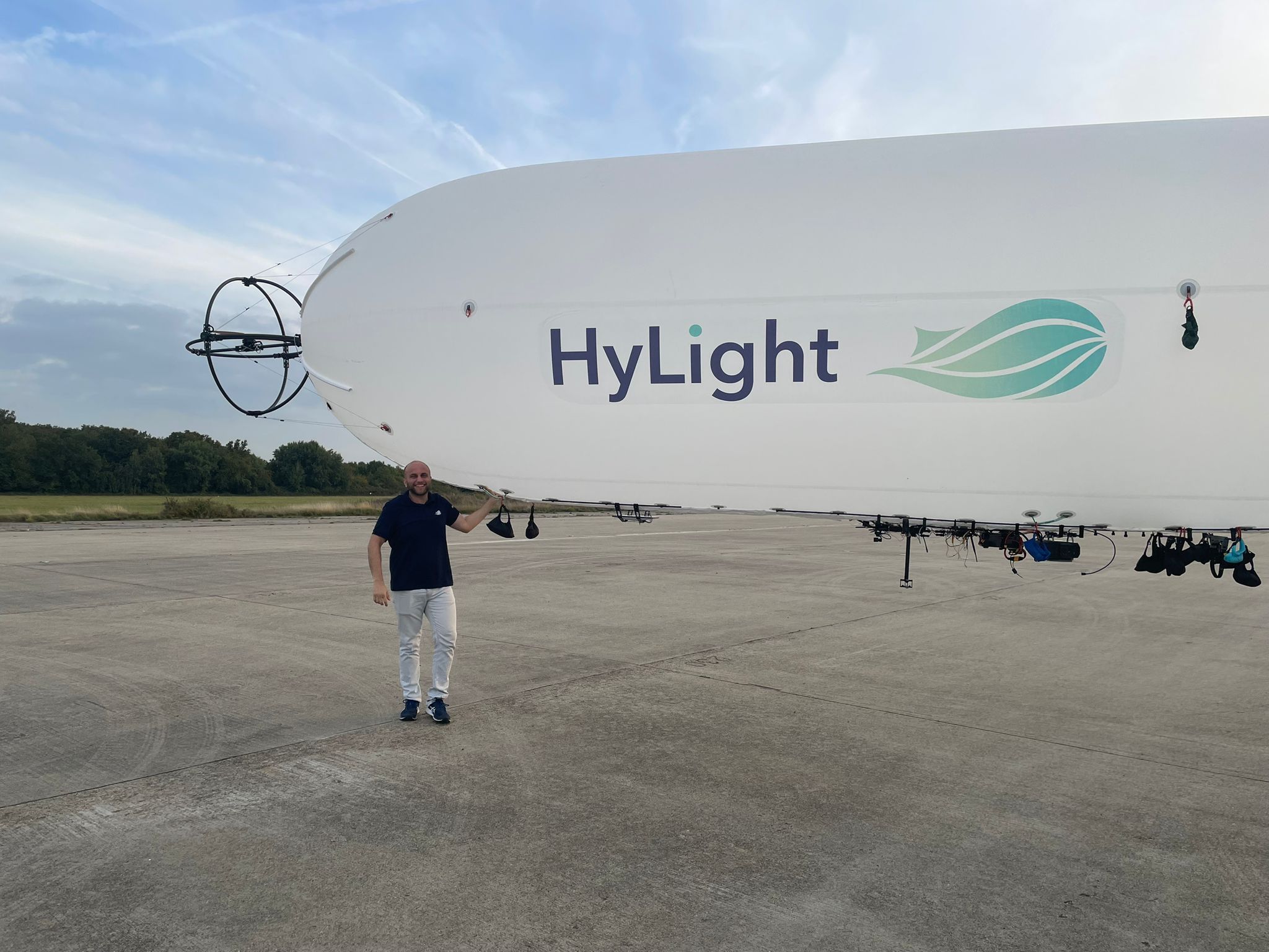 Ghadeer Shaaban beside the HyLighter airship on the runway